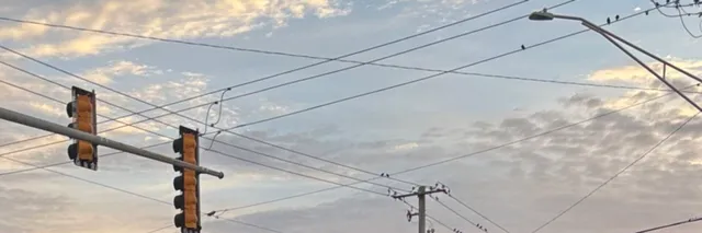 a bathroom with a granite countertop shower a mirror and a sink
