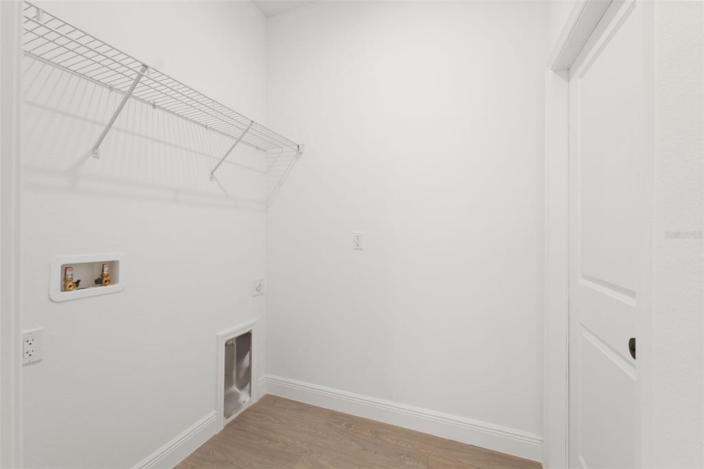 3350 Southwest 129th Loop Ocala, FL 34473 - Photo 26 of 33 a view of a room with racks on the wall