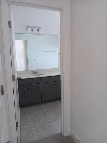 a room with a sink and cabinets
