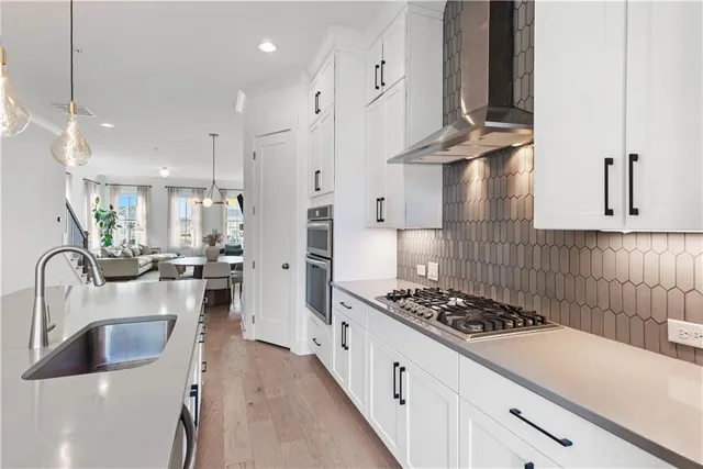a kitchen with stainless steel appliances a stove and a refrigerator