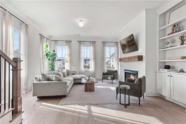 a living room with fireplace furniture and a flat screen tv