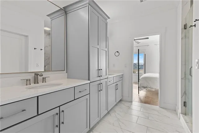 a bathroom with a sink and mirror