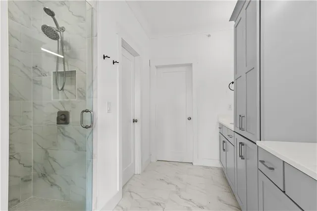 a bathroom with a sink and mirror