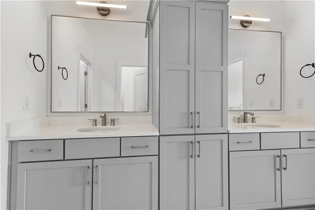 a bedroom with a bed and a mirror