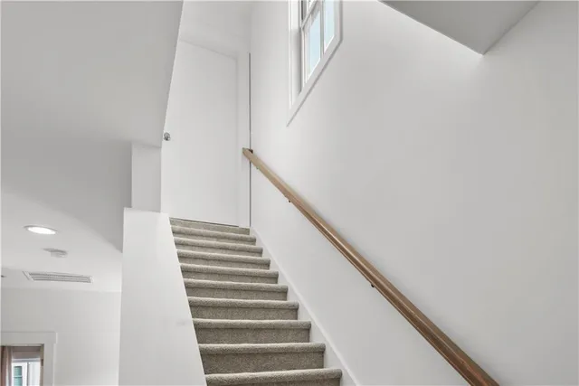 a view of a house with pool and a yard