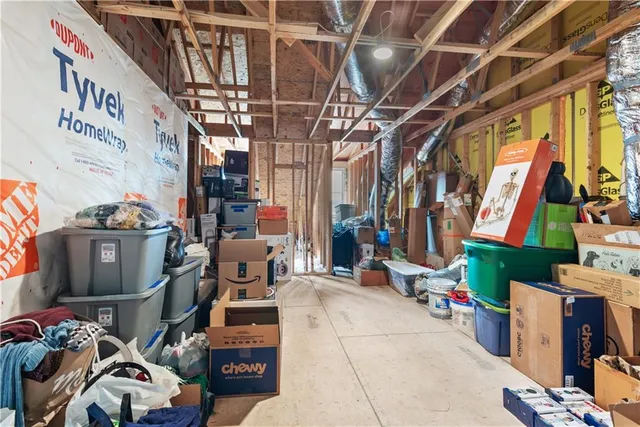 a view of a house with a yard and sitting area