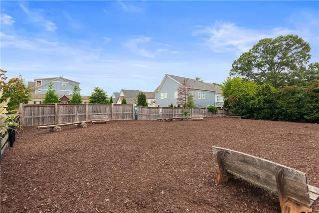 a view of a brick house with an outdoor space