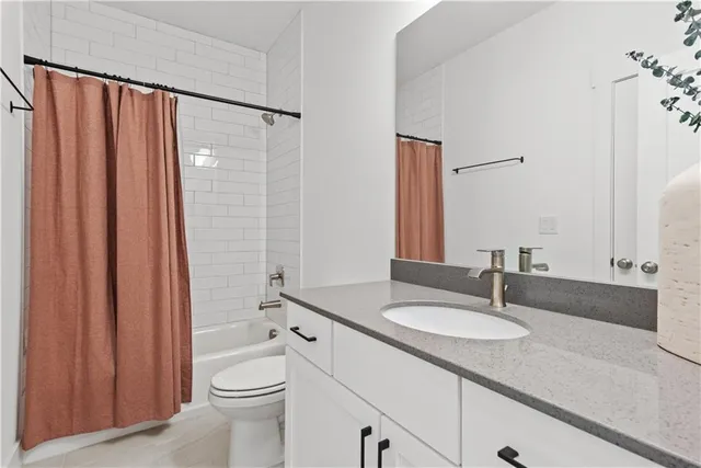 a kitchen with stainless steel appliances granite countertop a refrigerator a sink a stove and a center island