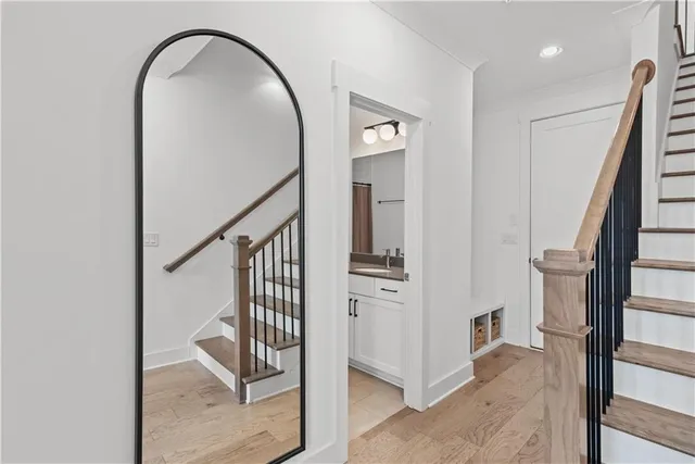 a kitchen with stainless steel appliances granite countertop a stove refrigerator and cabinets