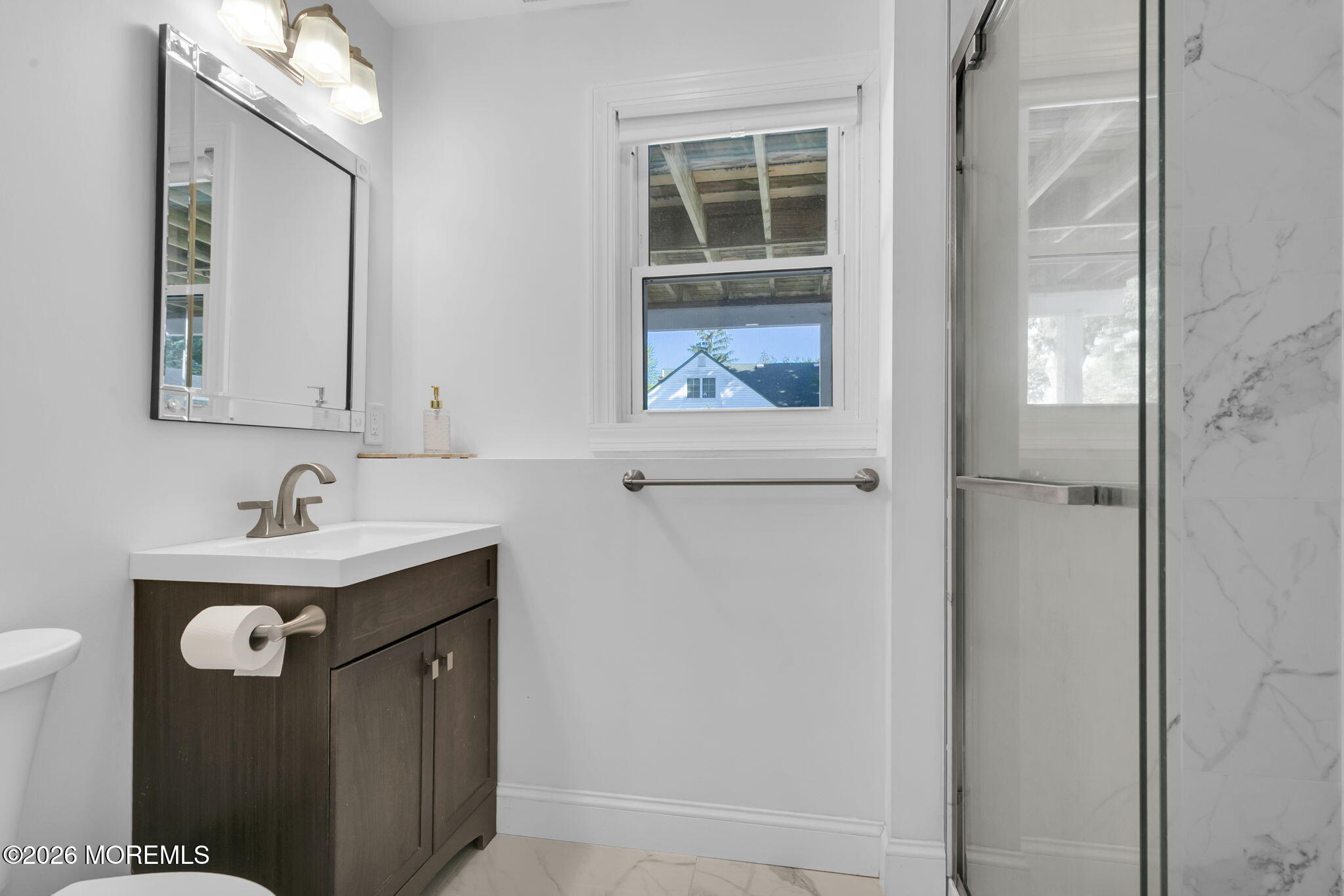 53 Field Avenue Red Bank, NJ 07701 - Photo 19 of 39 a bathroom with a sink a toilet and a mirror