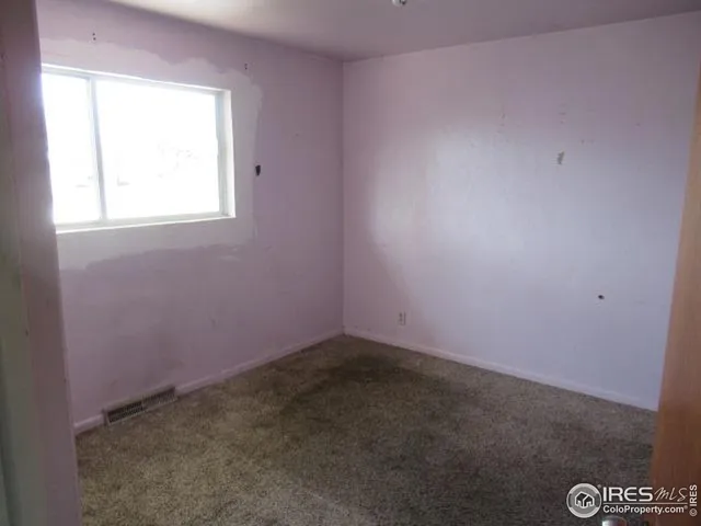 an empty room with a window