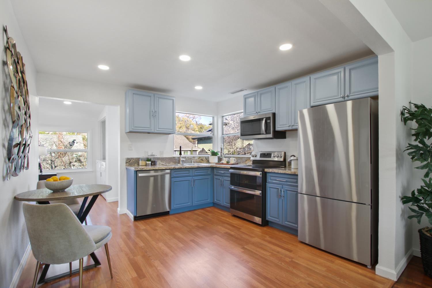 2905 Wood Street Placerville, CA 95667 - Photo 13 of 41 a kitchen with stainless steel appliances granite countertop a refrigerator stove microwave and sink