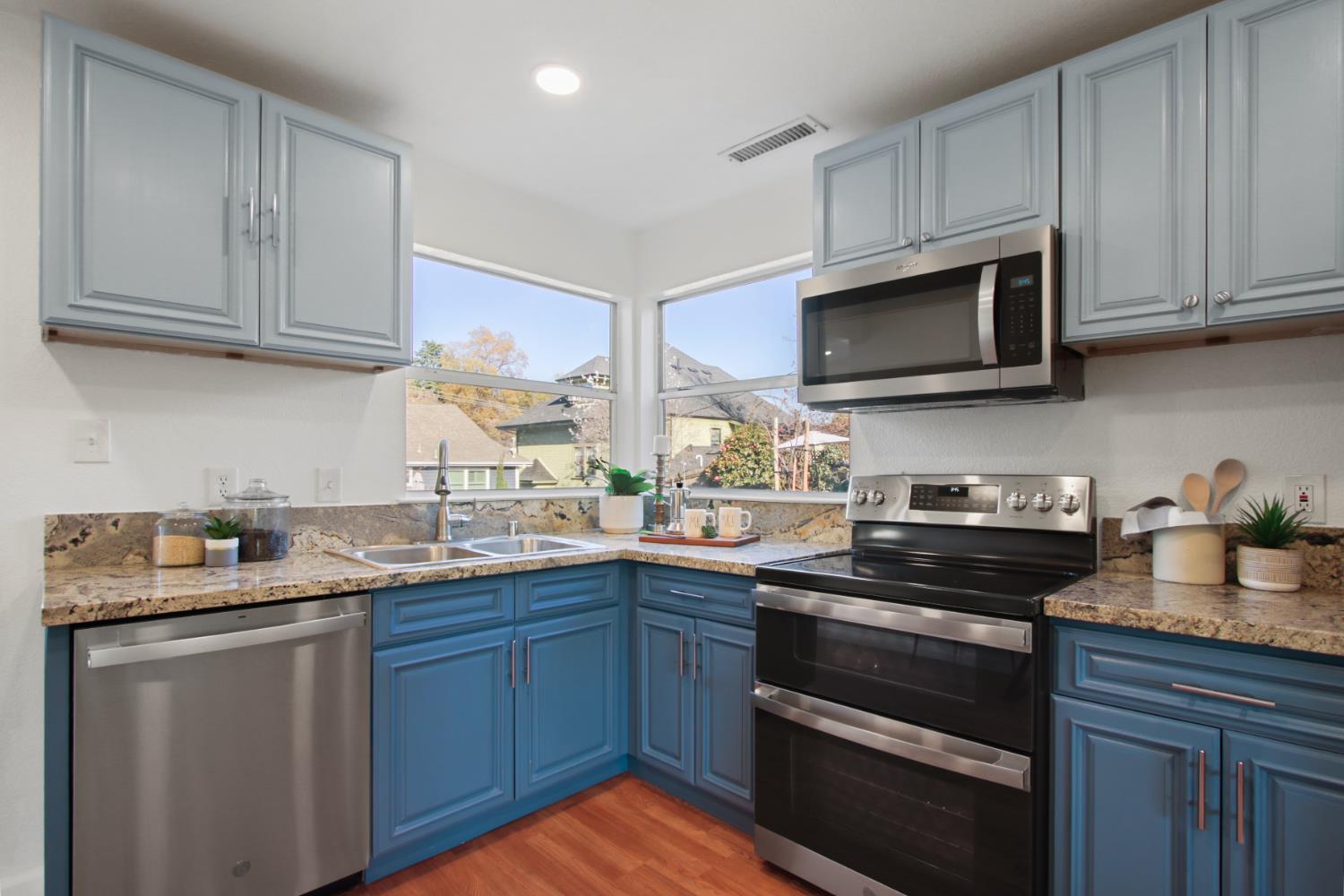 2905 Wood Street Placerville, CA 95667 - Photo 14 of 41 a kitchen with stainless steel appliances granite countertop a sink stove and microwave