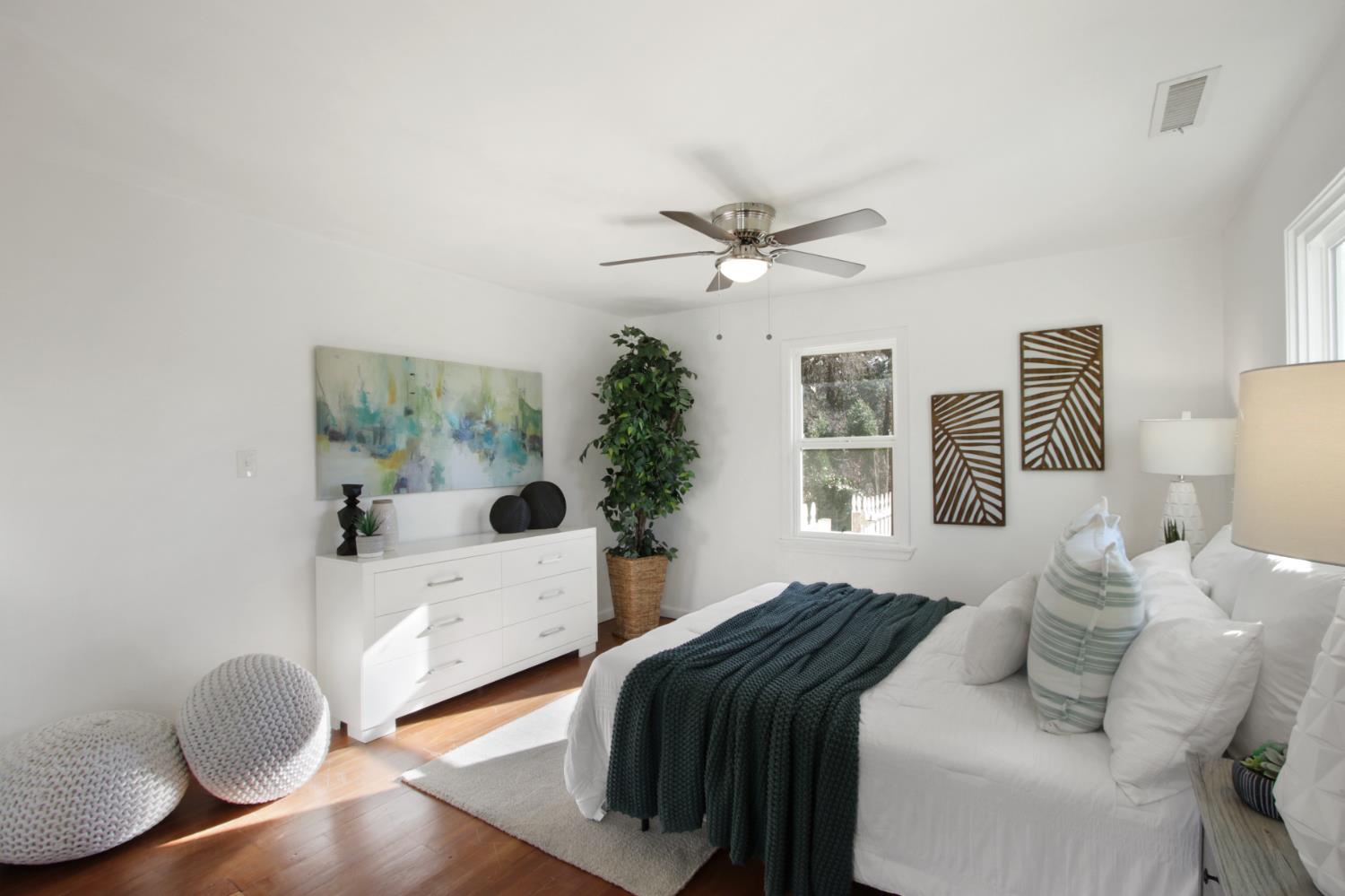 2905 Wood Street Placerville, CA 95667 - Photo 20 of 41 a bedroom with a bed and wooden floor