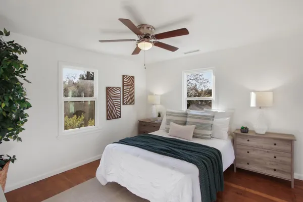 a bedroom with a bed and a window