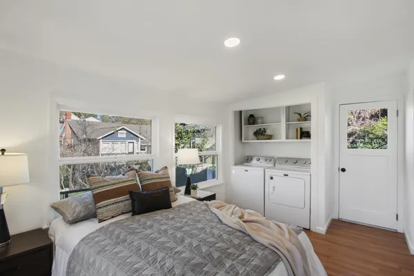 a bedroom with a bed and a couch