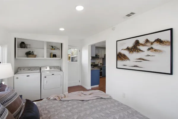 a view of a bedroom with closet and bathroom