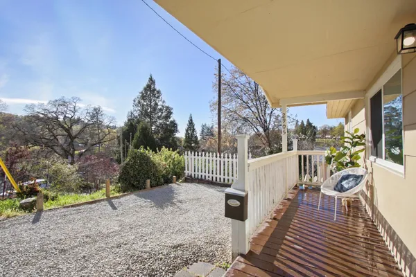 a view of a wooden deck with a bench