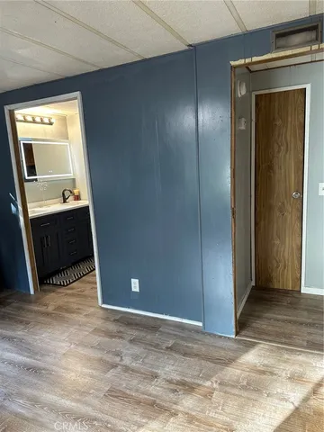 a view of walk in closet with clothes