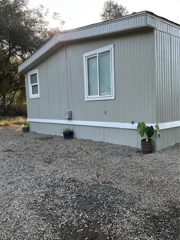 a view of a backyard with a small cabin