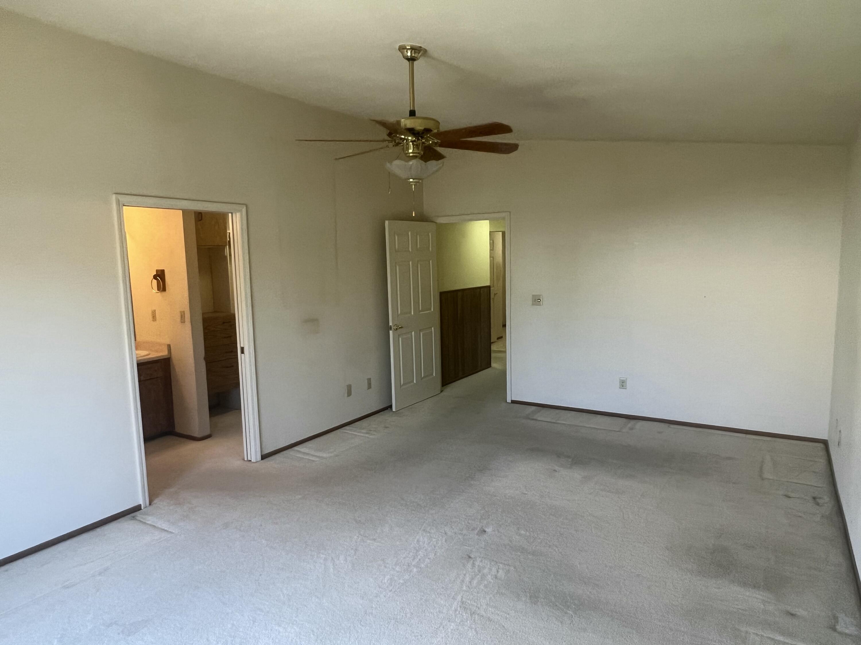 2010 Lazare Path Redding, CA 96001 - Photo 13 of 25 an empty room with a ceiling fan and a window