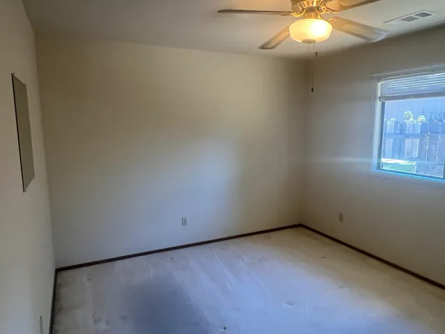 a view of an empty room with cabinet