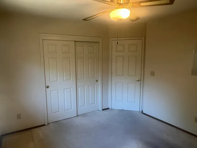 a view of empty room with windows