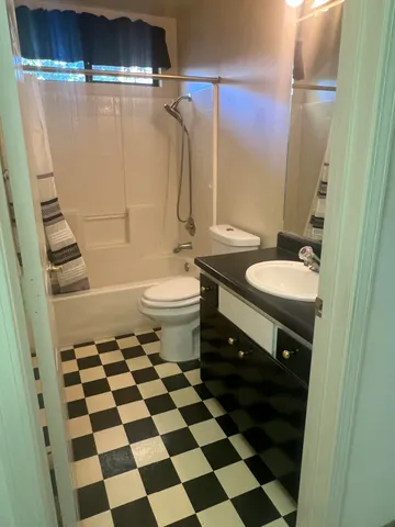 a view of a house with wooden floor and a yard