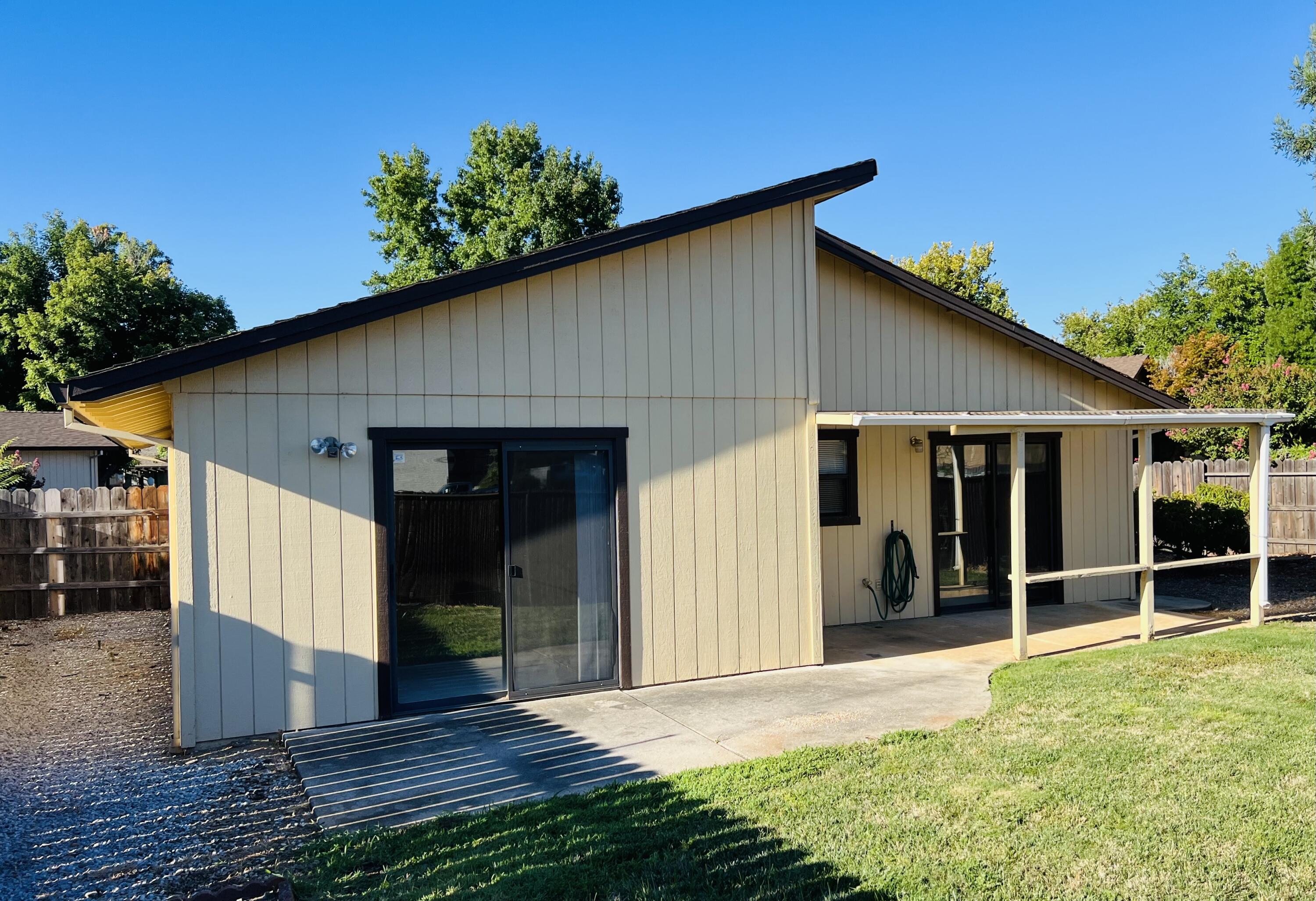 2010 Lazare Path Redding, CA 96001 - Photo 24 of 25 a view of a house with wooden floor and a yard