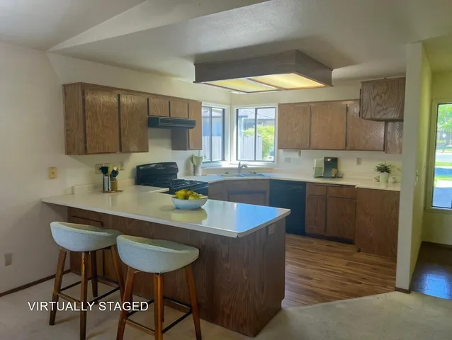 a kitchen with a sink and a stove top oven