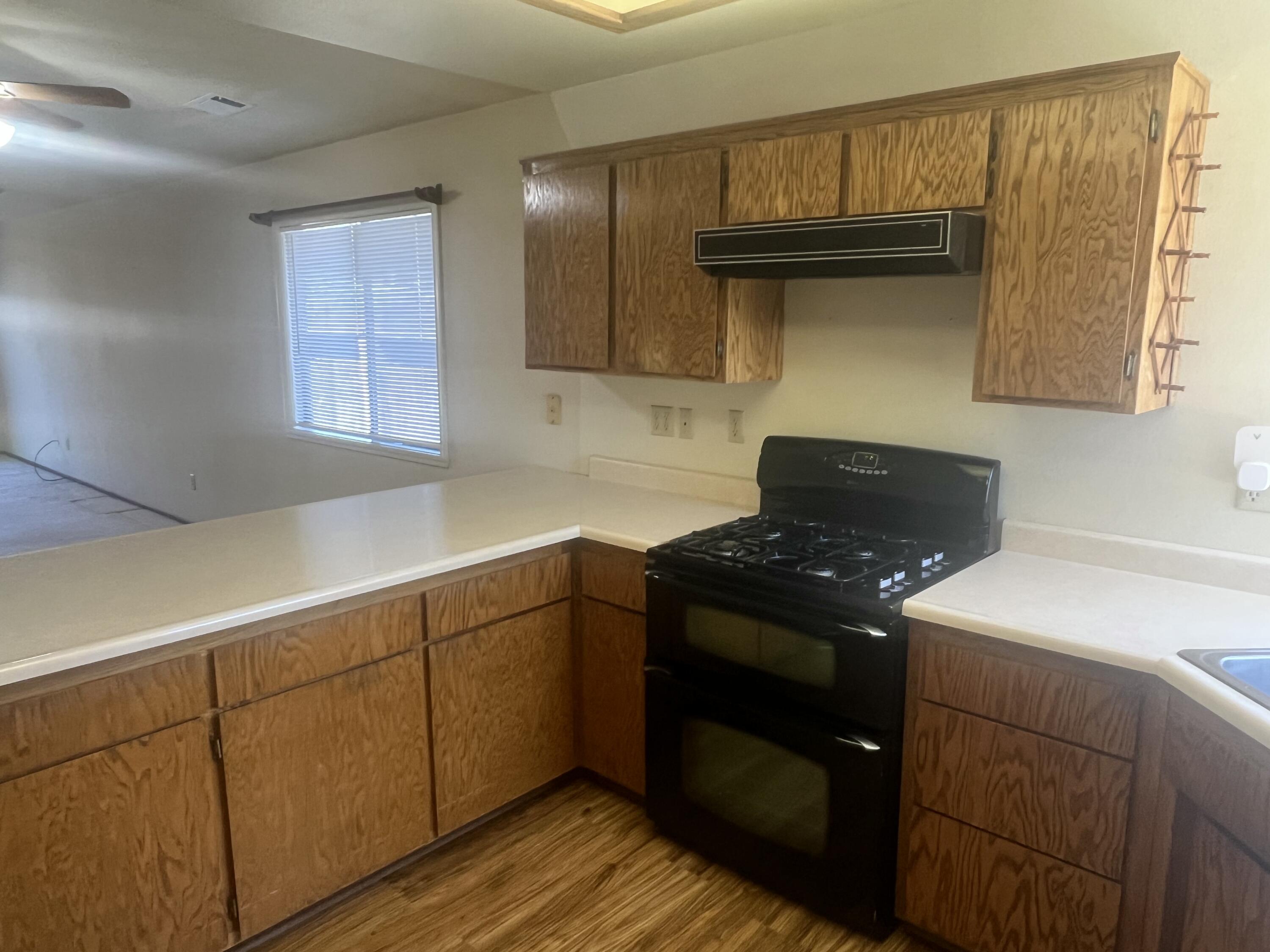 2010 Lazare Path Redding, CA 96001 - Photo 8 of 25 a kitchen with a sink and a stove top oven