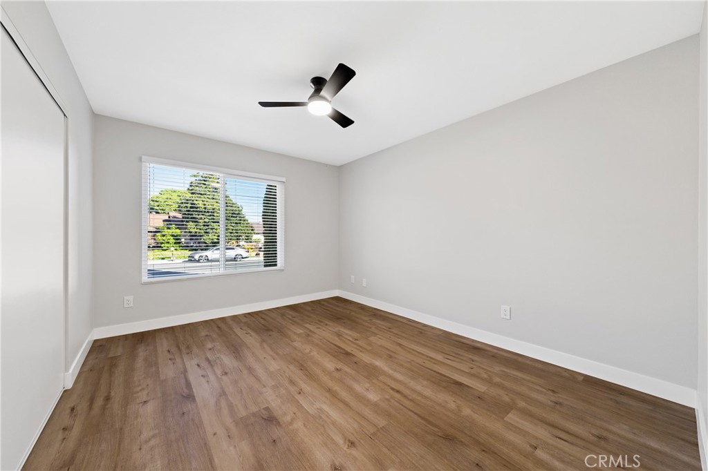 1413 Panorama Ridge Road Oceanside, CA 92056 - Photo 12 of 27 a view of an empty room with wooden floor and a window