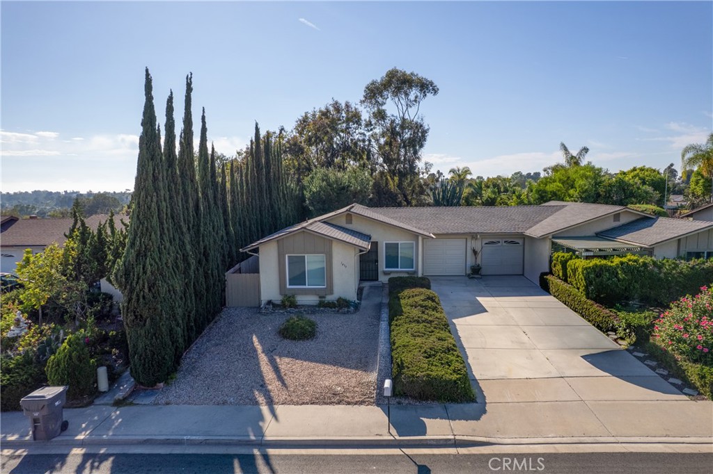 1413 Panorama Ridge Road Oceanside, CA 92056 - Photo 2 of 27 a front view of a house with garden