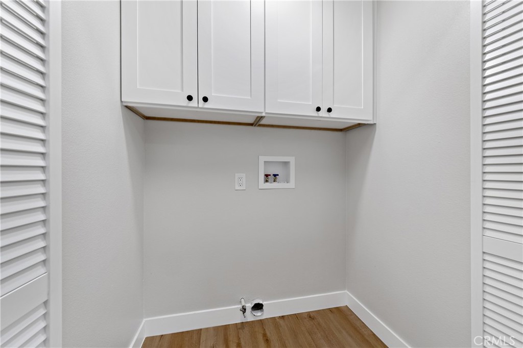 1413 Panorama Ridge Road Oceanside, CA 92056 - Photo 22 of 27 a view of cabinets and dryer