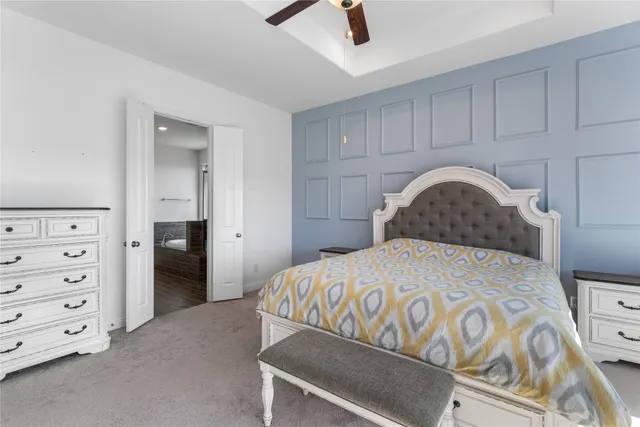 a bedroom with a bed and a cabinets