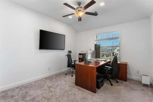 a view of a workspace with furniture