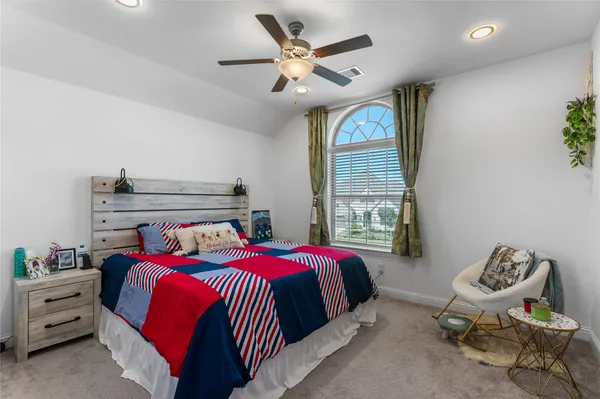 a bed room with a bed and a window