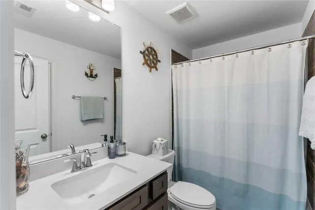 a bathroom with a sink and toilet