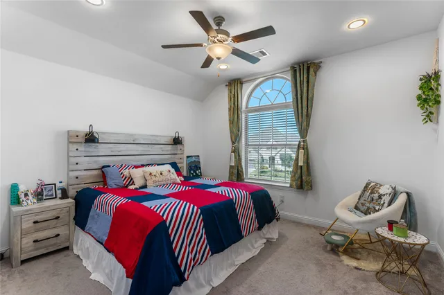 a bed room with a bed and a window