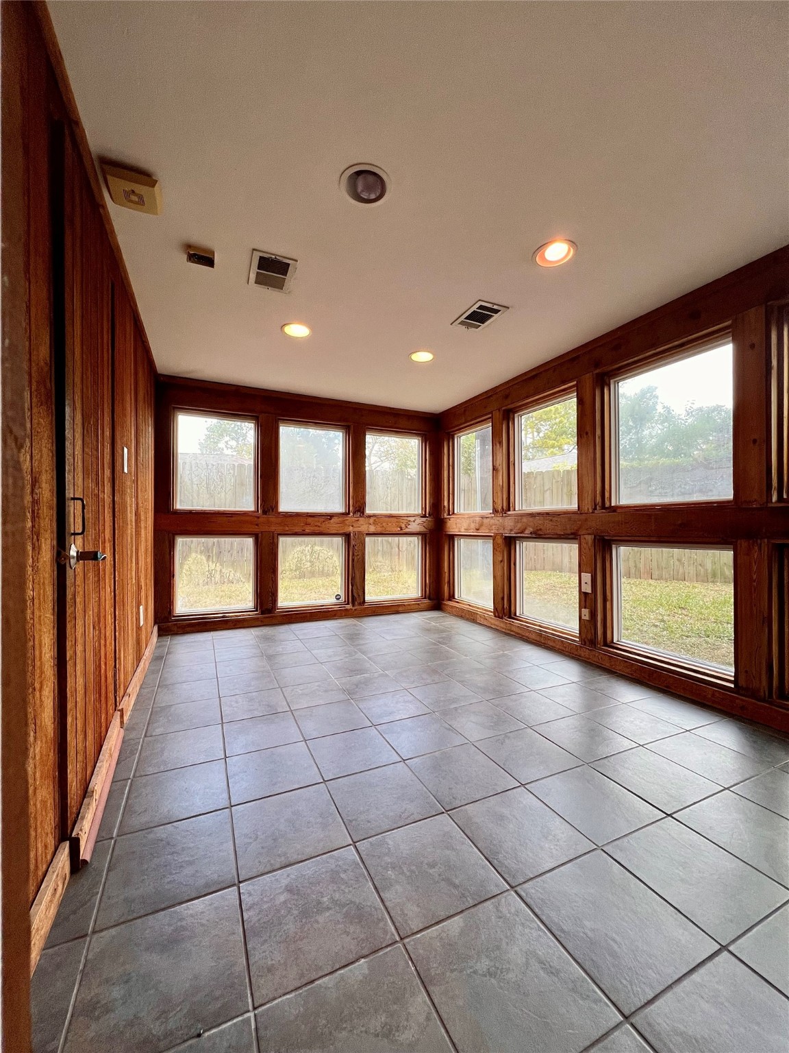 a view of an empty room with a large window