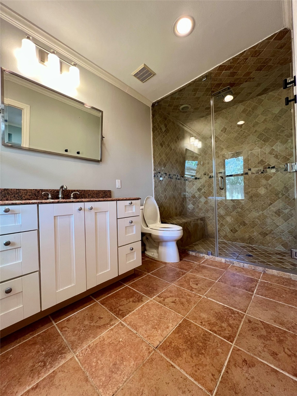 4218 Glebe Road Houston, TX 77018 - Photo 16 of 26 a bathroom with a mirror and a shower