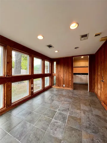 a kitchen with kitchen island granite countertop a sink and steel stainless steel appliances