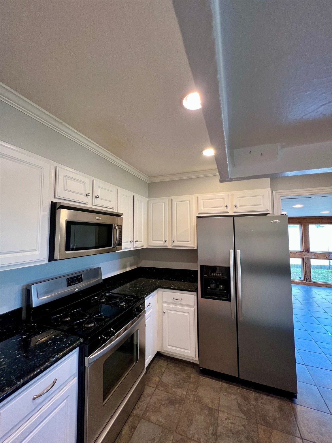 4218 Glebe Road Houston, TX 77018 - Photo 18 of 26 a kitchen with kitchen island granite countertop a sink and steel stainless steel appliances