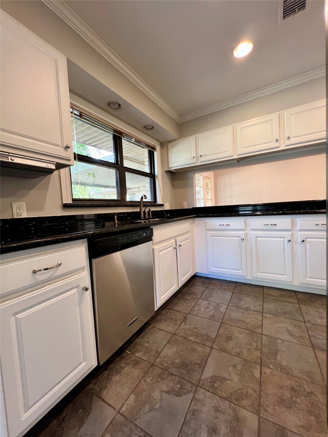 4218 Glebe Road Houston, TX 77018 - Photo 20 of 26 a kitchen with granite countertop a sink stainless steel appliances and cabinets