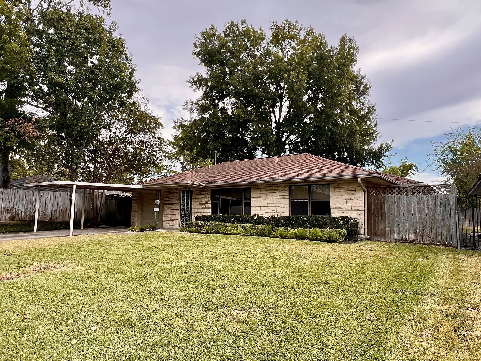 4218 Glebe Road Houston, TX 77018 - Photo 26 of 26 a front view of a house with yard and fence