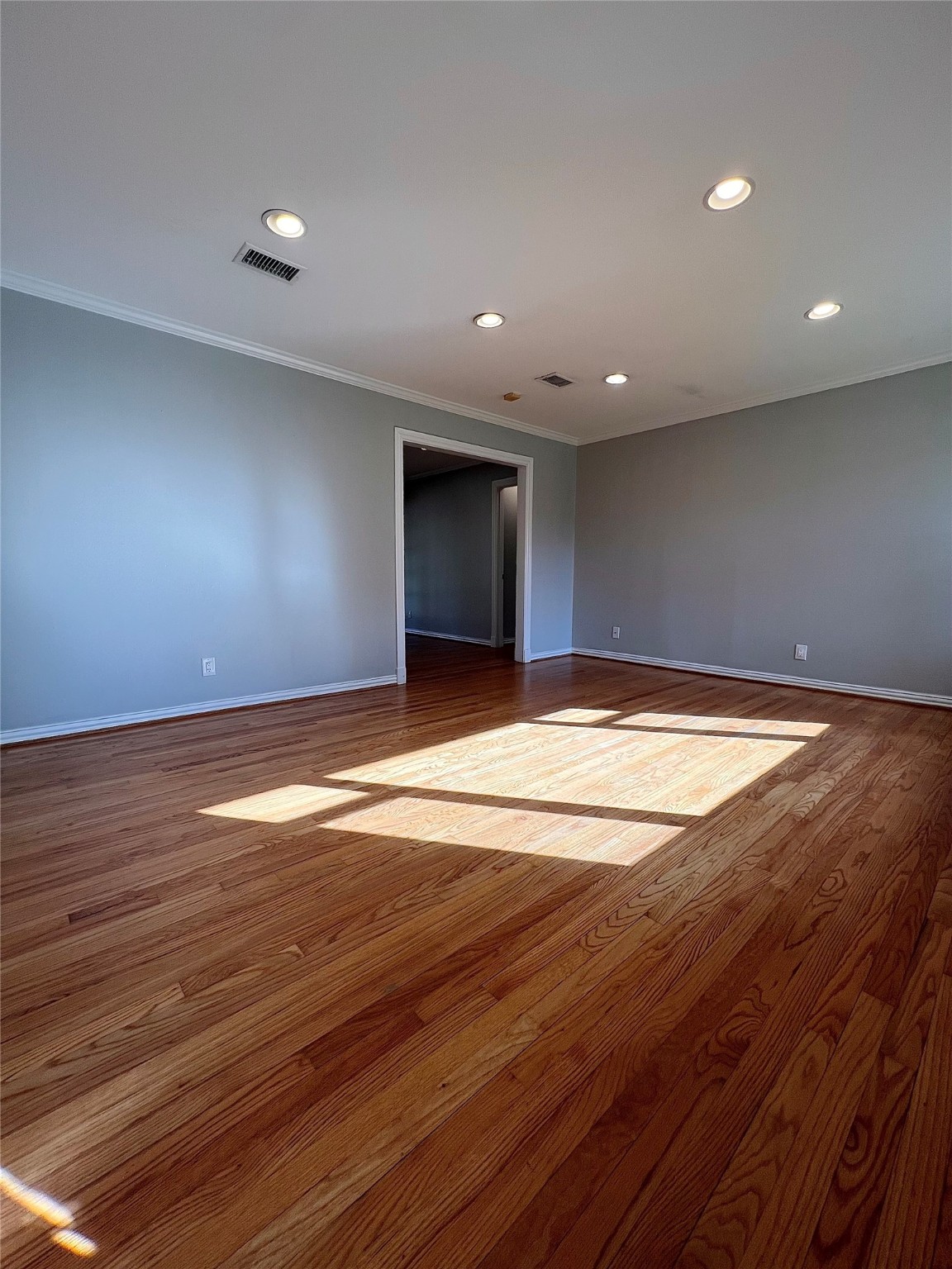 4218 Glebe Road Houston, TX 77018 - Photo 5 of 26 a view of a livingroom with wooden floor