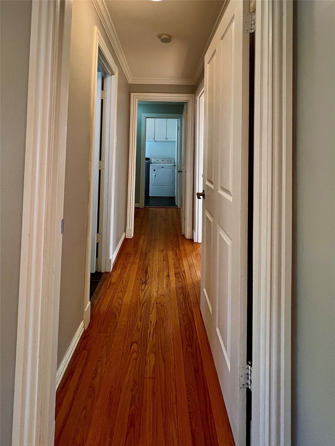 4218 Glebe Road Houston, TX 77018 - Photo 8 of 26 a view of a hallway with wooden floor and staircase