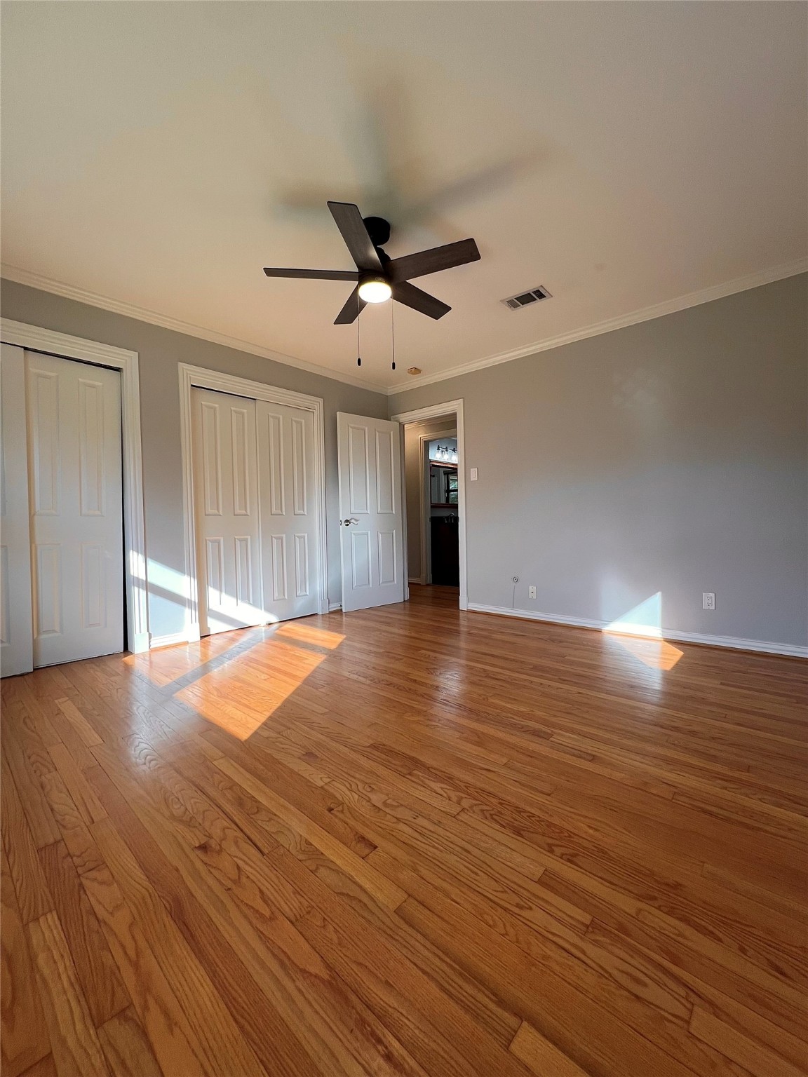 4218 Glebe Road Houston, TX 77018 - Photo 10 of 26 a view of an empty room with wooden floor