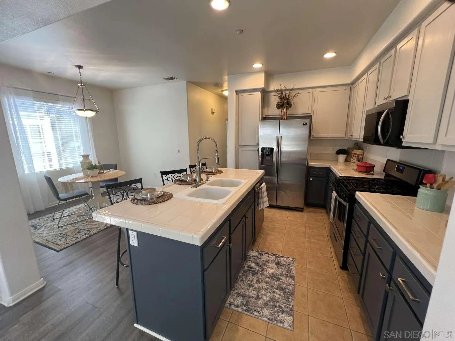 362 Borden Road San Marcos, CA 92069 - Photo 2 of 23 a kitchen with refrigerator and cabinets