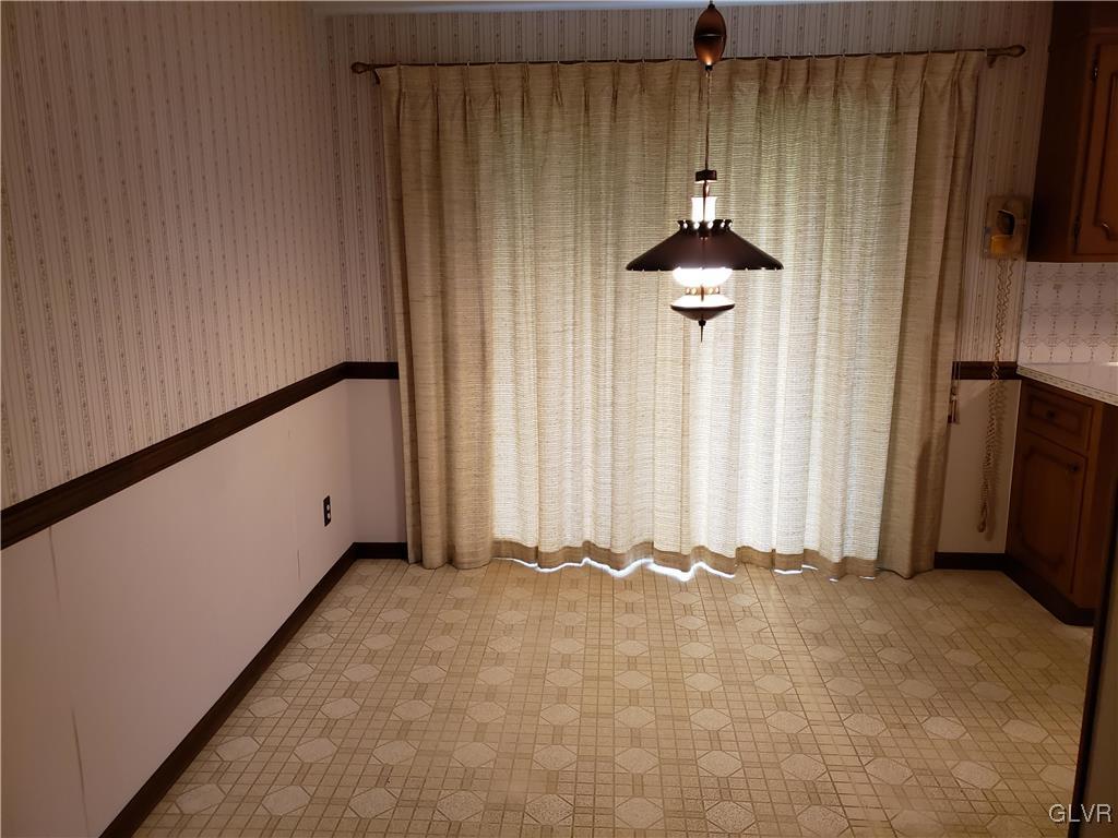 2341 Yost Road Bath, PA 18014 - Photo 15 of 24 a bedroom with a bed and a chandelier